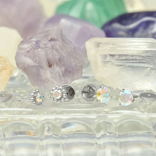 Aurora Borealis earrings with gemstones on a decorative stand with crystals in the background. Made by ComfyEarrings