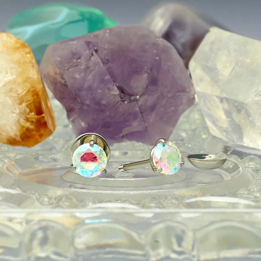 Aurora Borealis Martini Prong earrings on a stand with crystal background.