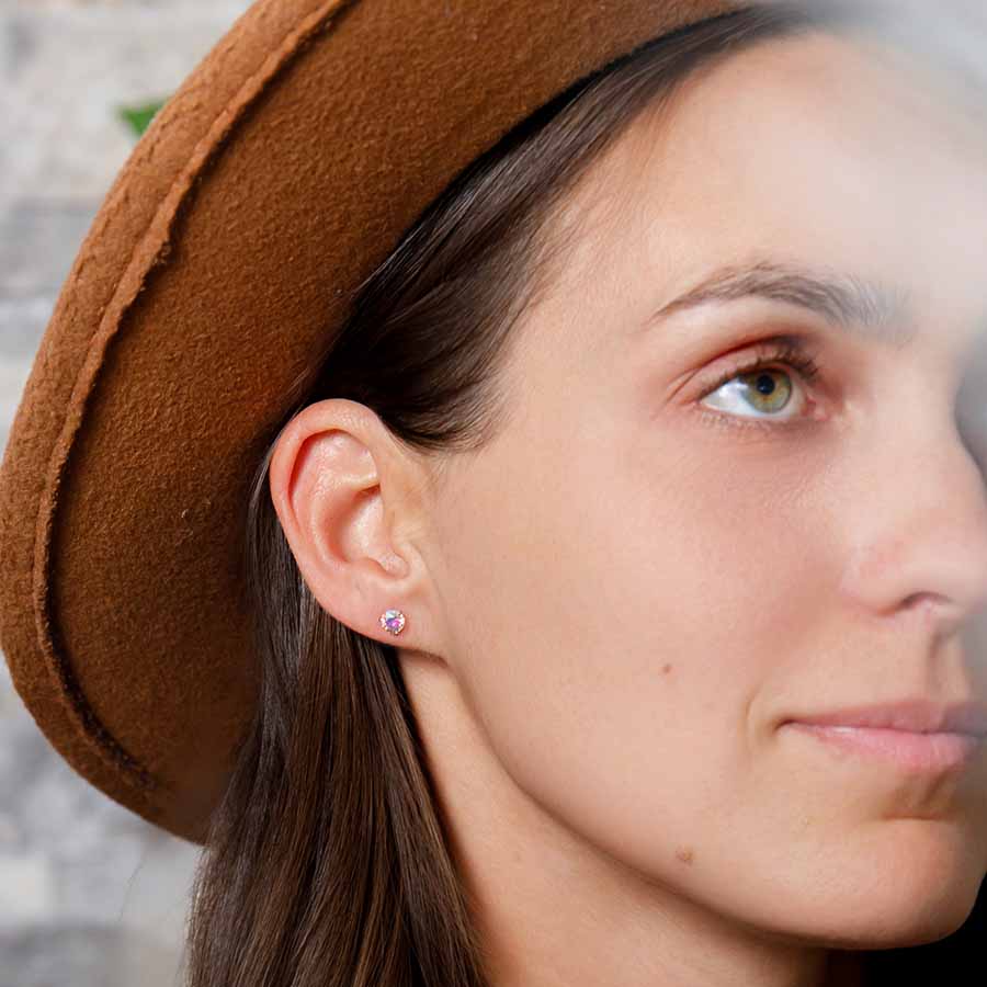 Aurora Borealis Martini Prong Earrings in a woman's ears.