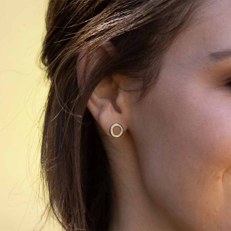 close up of a model wearing Open Circle Titanium ComfyEarrings