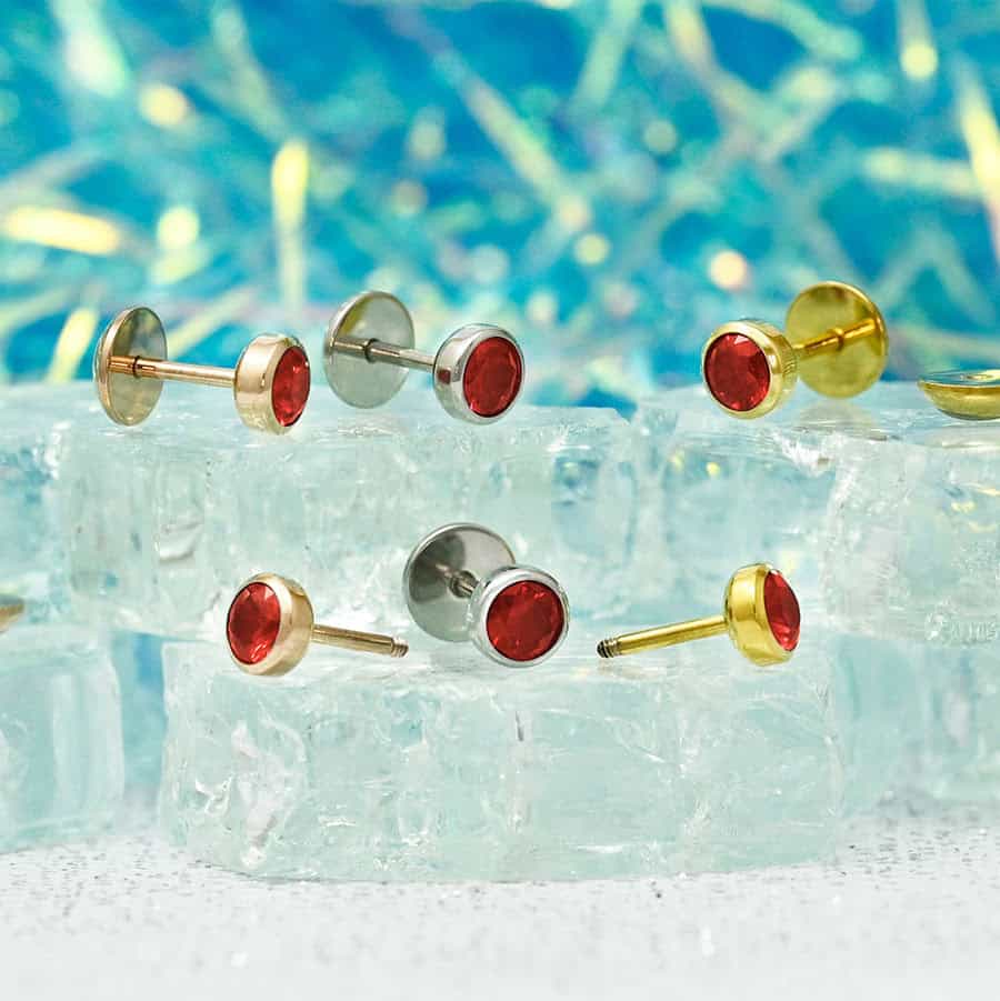 Ruby Red ComfyEarrings in rose gold, stainless, and gold.