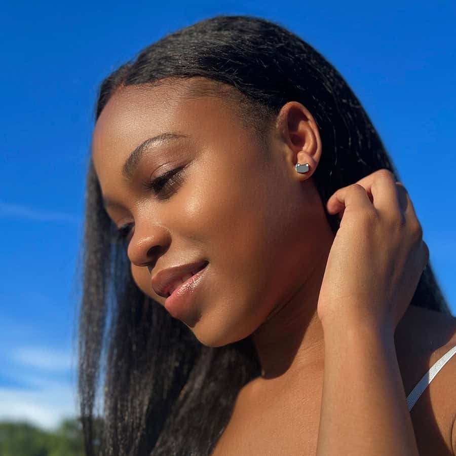 Stainless Cats pictured in a model's ear