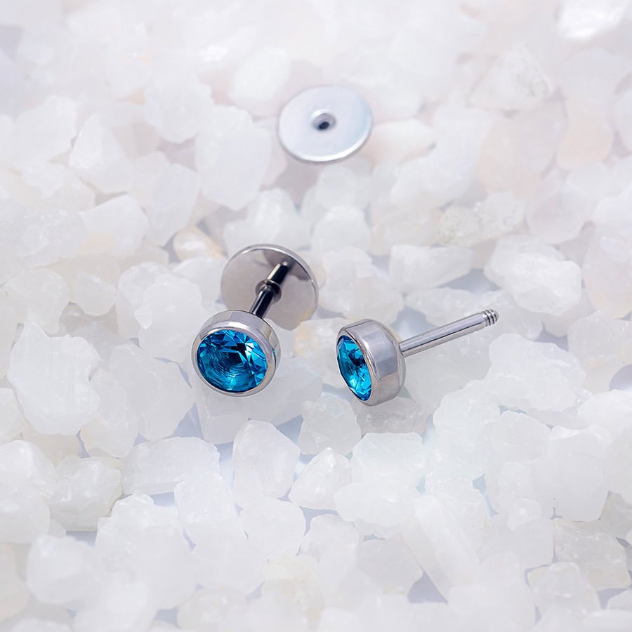 Blue Topaz ComfyEarrings on white rocks
