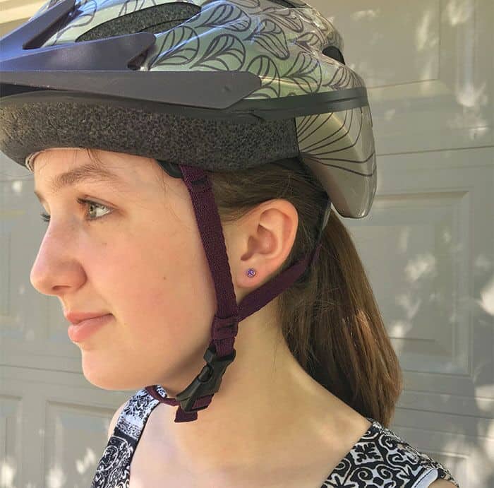 Wearing Amethyst ComfyEarrings with a helmet