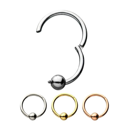 Stainless, gold, and rose gold hoop earrings on a white background