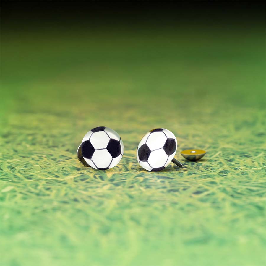 Soccer ball Featuring homemade DIY ComfyEarrings on a green textured surface