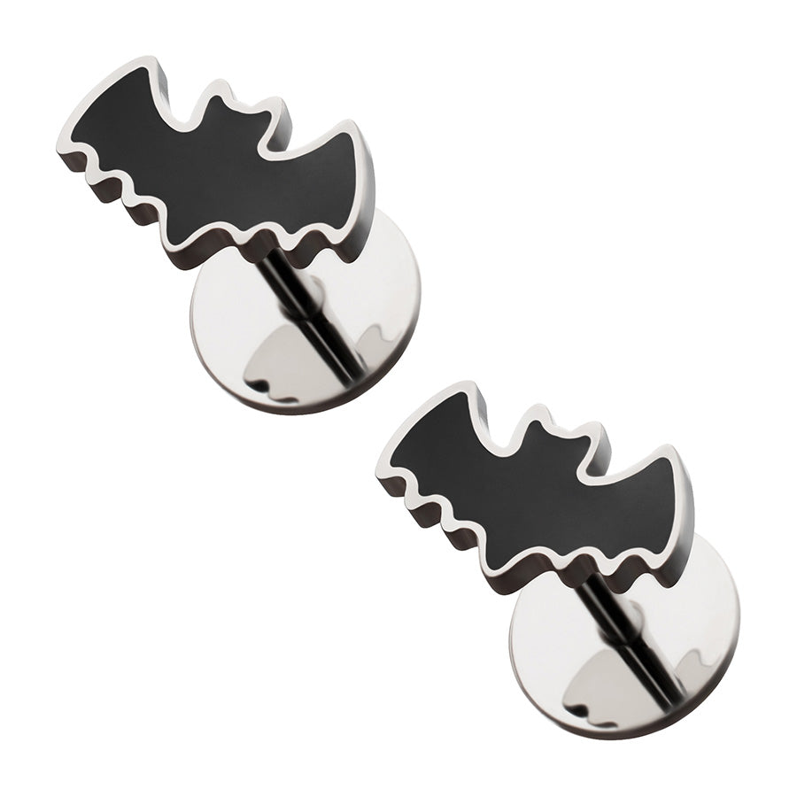 Pair of bat-shaped earrings on a white background