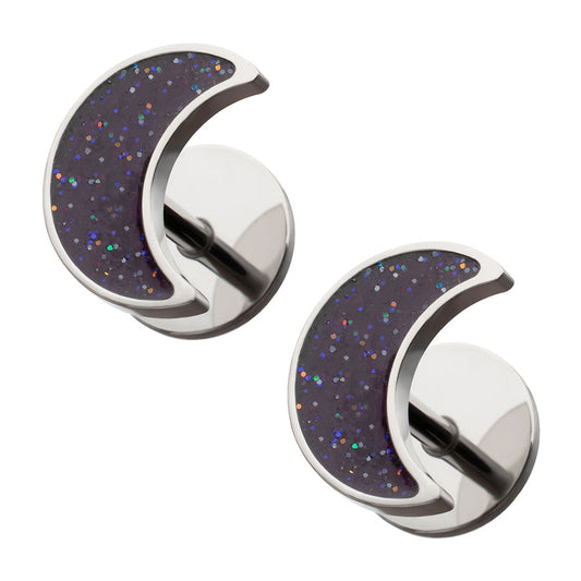 Crescent moon-shaped earrings with speckled design on a white background