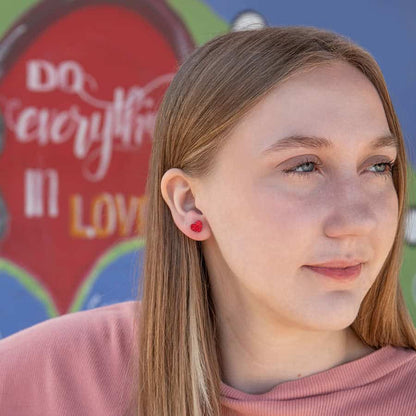 Glitter Heart ComfyEarrings in a girl's ear