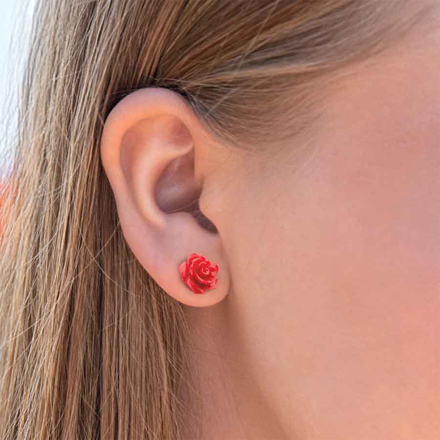 Red Rose ComfyEarrings pictured close up in an ear.