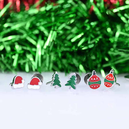 Christmas stud earrings in a row. Santa Hats, Green Trees, and Ornaments.