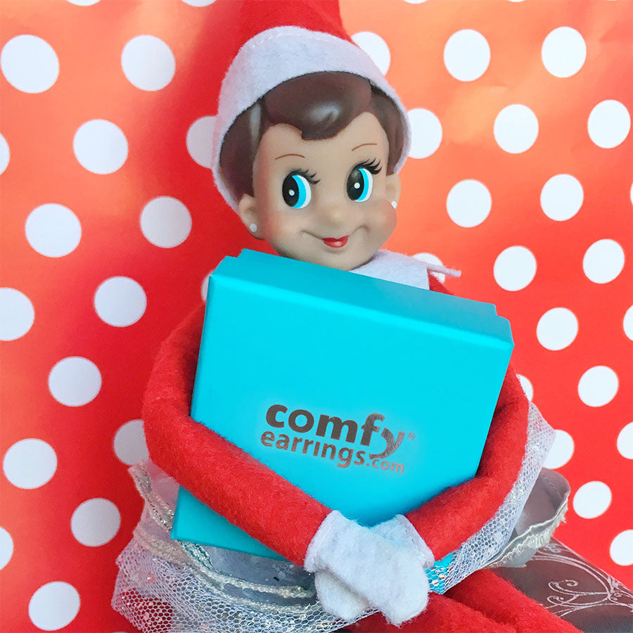 elf on the shelf holding ComfyEarrings gift box