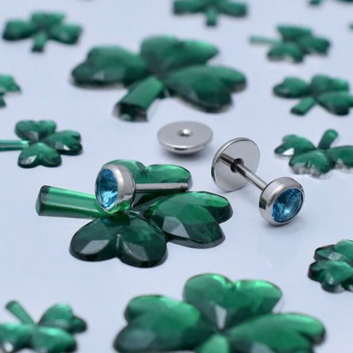 Aquamarine ComfyEarrings with green clover decoration.