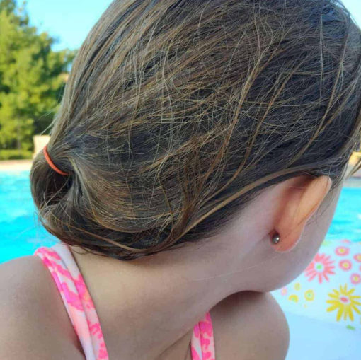 ComfyEarrings worn by a fan by the pool
