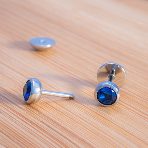 Blue Sapphire ComfyEarrings on bamboo board.