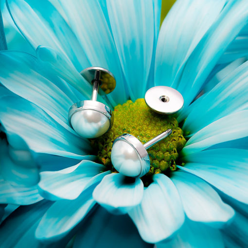 Half Pearl ComfyEarrings on blue flower