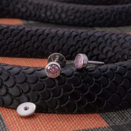 Rose Pink ComfyEarrings on a black rubber snake.
