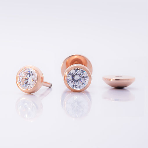 Crystal Clear Rose Gold ComfyEarrings on shiny white background.
