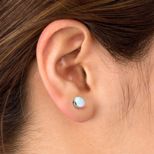 White Opal ComfyEarrings in ear.
