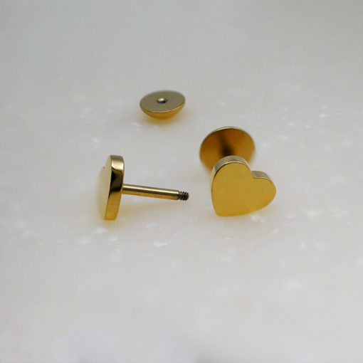 Gold Heart ComfyEarrings on white background.
