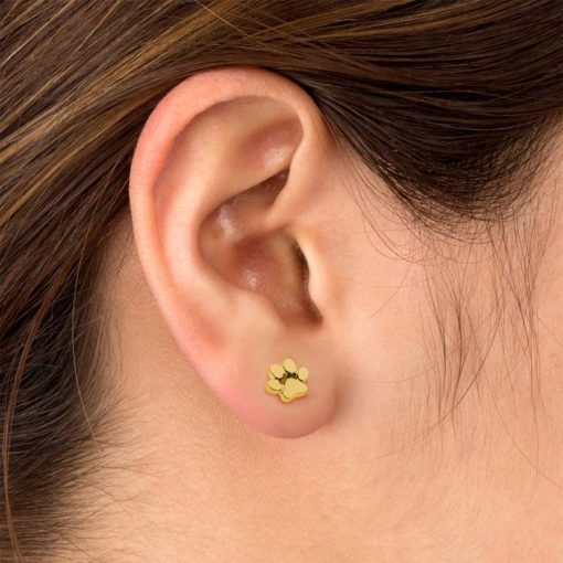 Gold Paw Print ComfyEarrings in ear