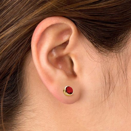 Ruby Red Gold ComfyEarrings in ear.