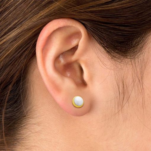 Half Pearl Gold ComfyEarrings pictured in the ear.