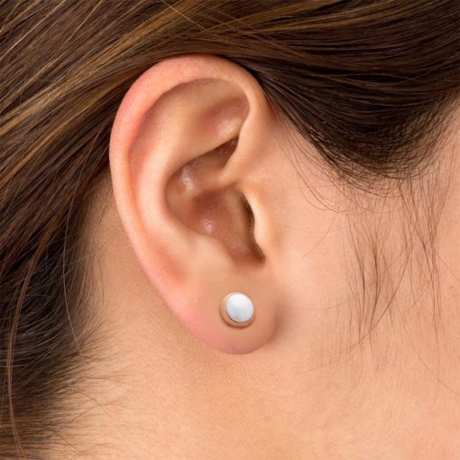 Half Pearl Rose Gold ComfyEarrings pictured in the ear.