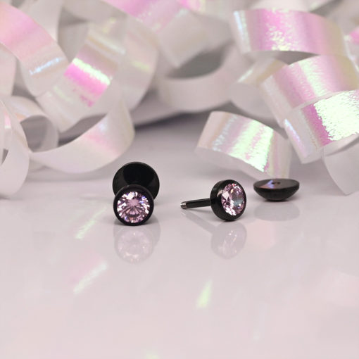 Modern Rose Pink ComfyEarrings in front of white ribbon with pink sheen.