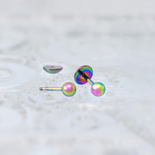Multicolor Ball ComfyEarrings on a patterned clear serving dish