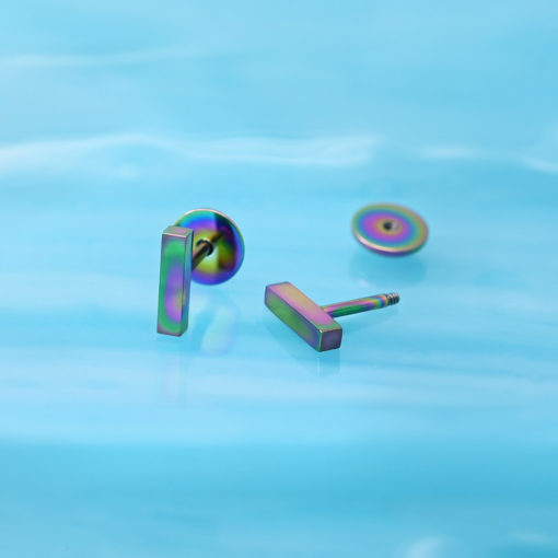 Multicolor Bar ComfyEarrings on a reflective blue background