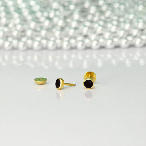 Black Onyx Gold ComfyEarrings sitting in front of silver beads