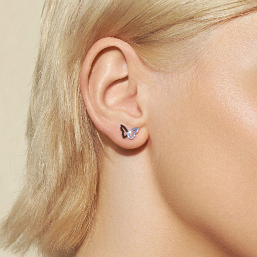 Stainless Butterfly ComfyEarrings in the ear of a model.