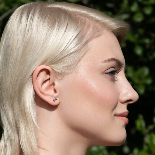 Bone ComfyEarrings pictured in a model's ear.