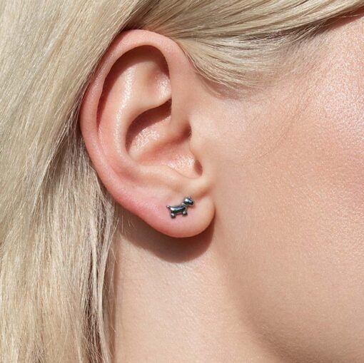 Dog ComfyEarrings pictured in a models ear from the side.