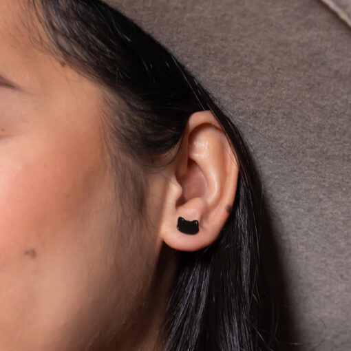 Modern (Black) Cat ComfyEarrings pictured in a model's ear.