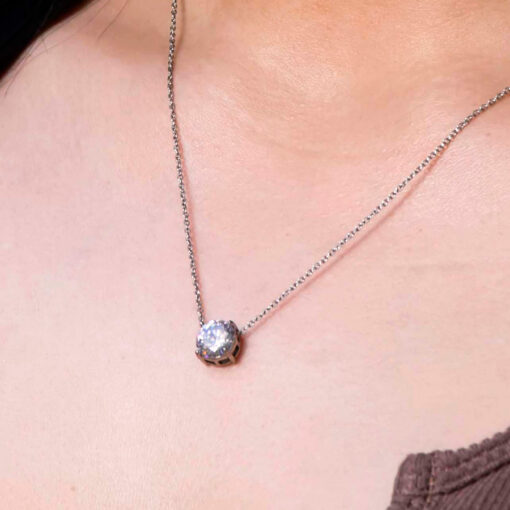 Crystal Clear Prong Necklace by ComfyEarrings close up view on a model's neck.