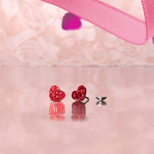 Glitter-Heart-ComfyEarrings with pink background