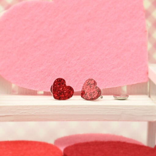 Glitter Heart ComfyEarrings pictured with pink decor.