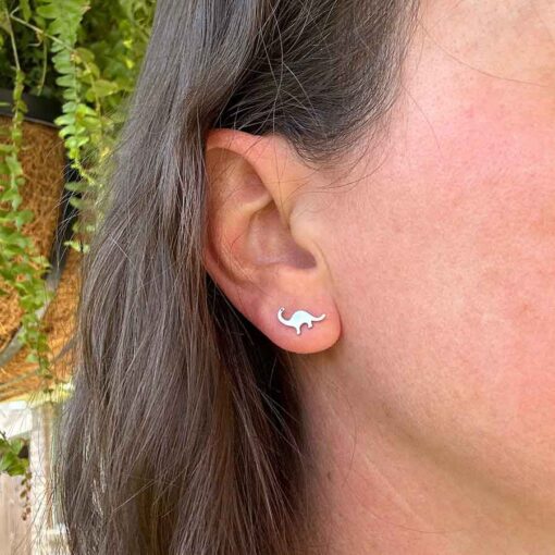 Dinosaur ComfyEarrings in ear image