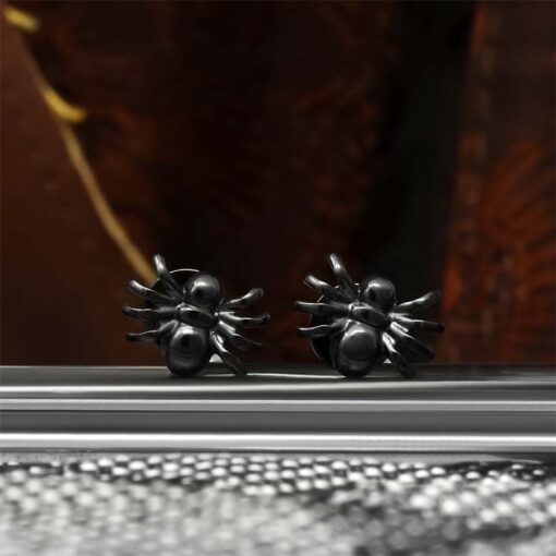 Black Spider ComfyEarrings shown in an artful picture.